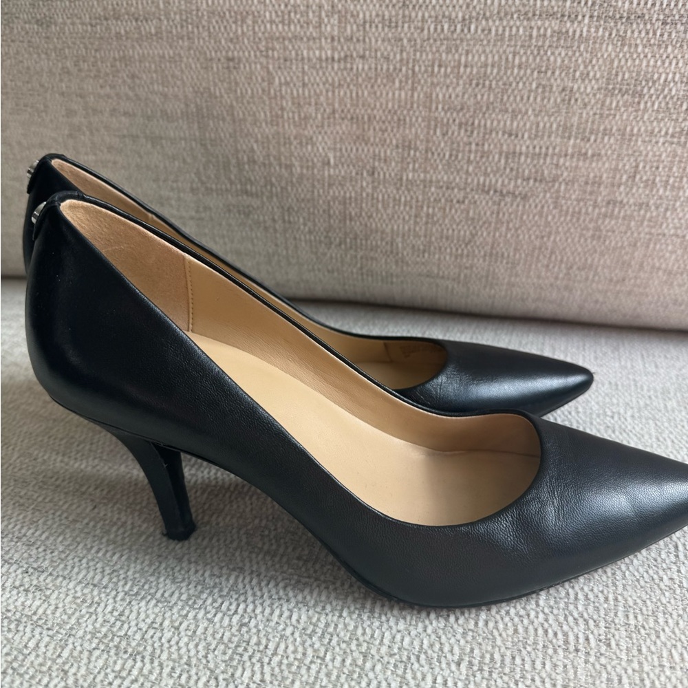 Michael Kors pumps black sz 8. leather upper, but the lower heels have scratches
